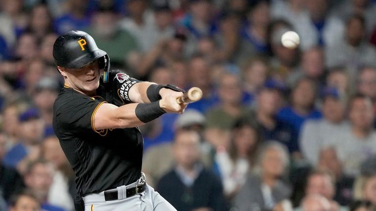 Pittsburgh Pirates' Henry Davis hits a two-run single off Chicago...