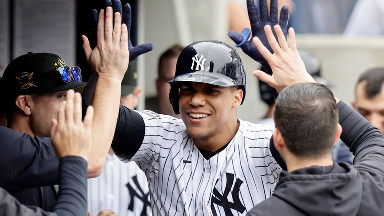 Juan Soto #22 of the Yankees celebrates his fifth inning home...