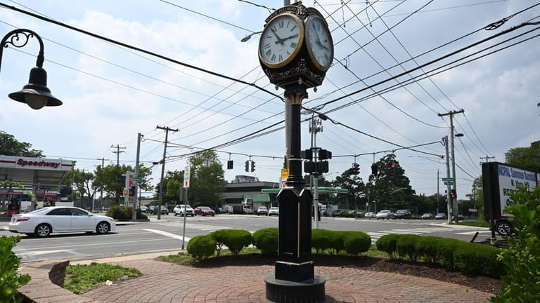 The North Bellmore clock greets drivers at the busy intersection...