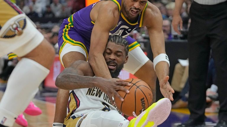 Utah Jazz guard Talen Horton-Tucker, rear, and New Orleans Pelicans...