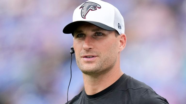 Atlanta Falcons quarterback Kirk Cousins watches during the first half...