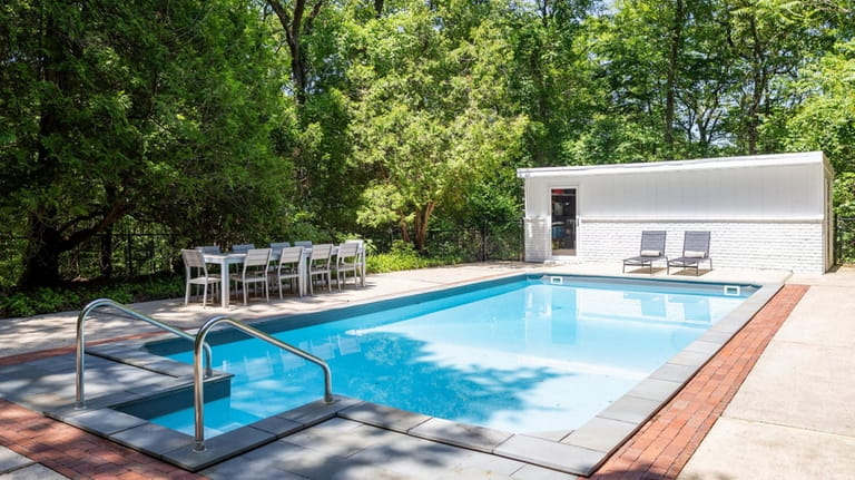 The property features a 16-by-32-foot pool and pool house.