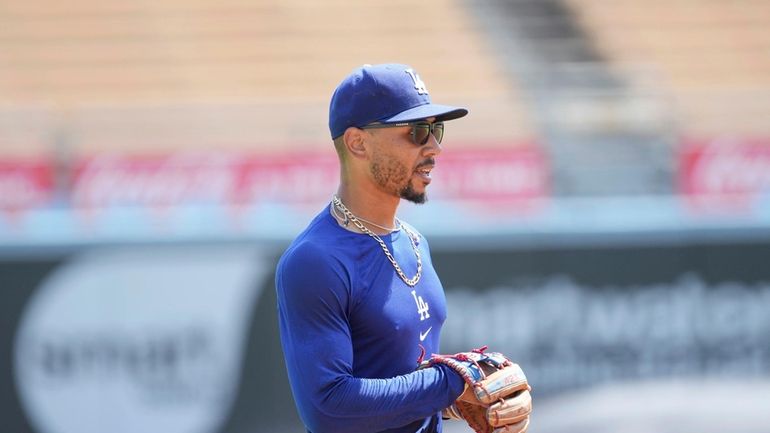 Los Angeles Dodgers' Mookie Betts works out prior to a...