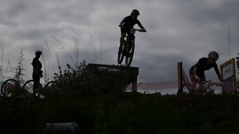 British team members practice at the Mountain Bike cycling track,...