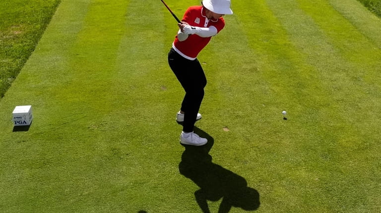 Amy Yang, of South Korea, hits from the first tee...