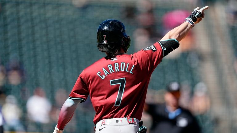 Arizona Diamondbacks' Corbin Carroll celebrates as he circles the bases...