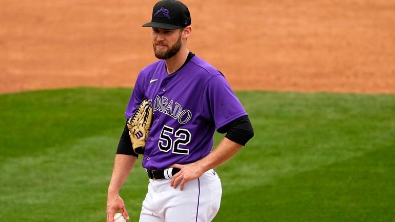 Colorado Rockies relief pitcher Daniel Bard (52) is pulled from...