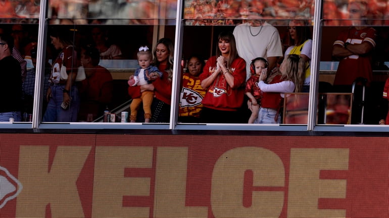 Taylor Swift watches from a suite during the first half...