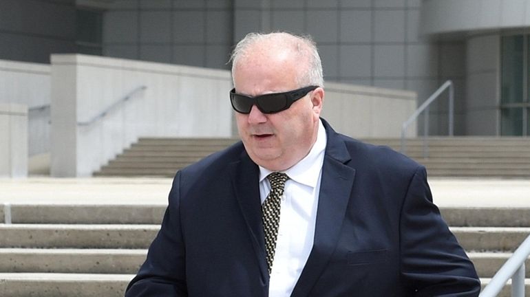 Former Suffolk County Legis. Fred Towle Jr. leaves federal court in...