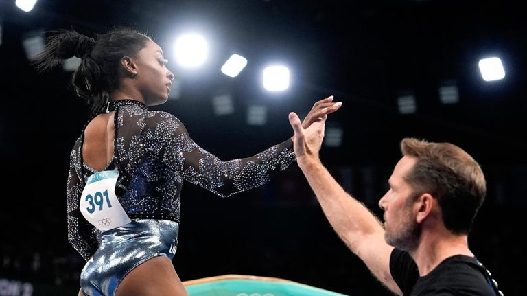 Simone Biles, of United States, prepares to compete on the...