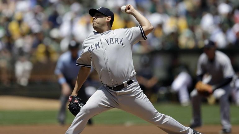 Yankees' Vidal Nuno works against the Oakland Athletics in the...