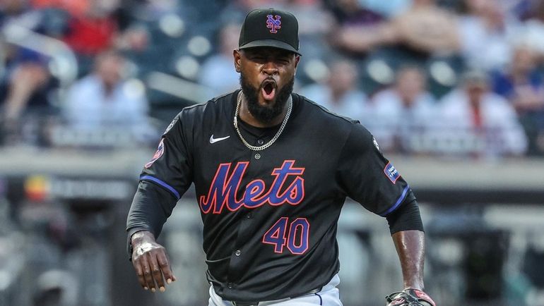 Mets pitcher Luis Severino reacts after getting out of the...