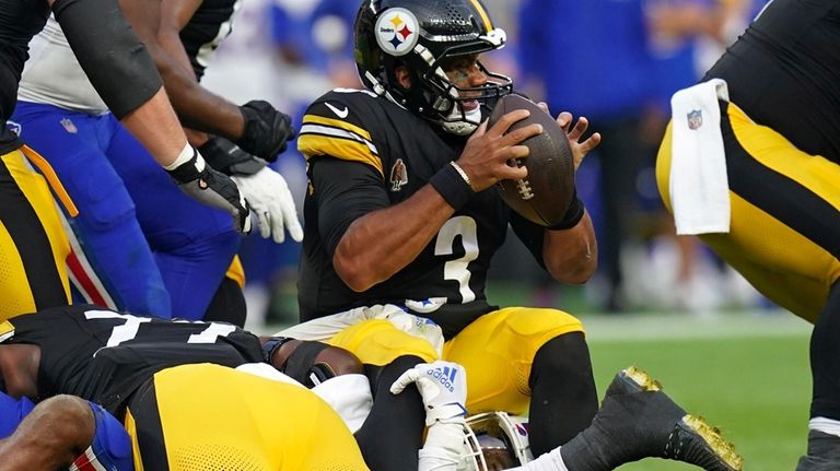 Pittsburgh Steelers quarterback Russell Wilson (3) is sacked by Buffalo...