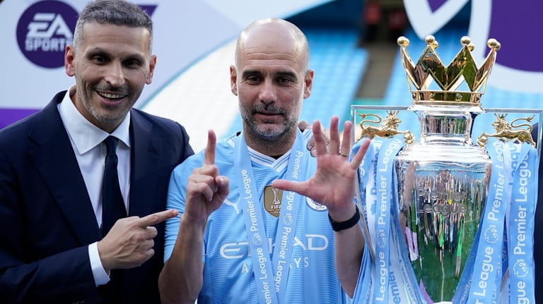 Manchester City's head coach Pep Guardiola, right, and Manchester City...