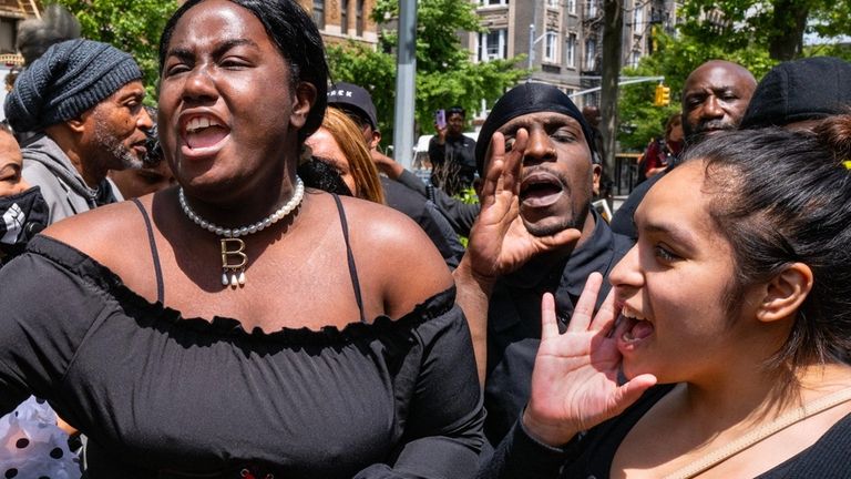 Mourners chant at the end of the funeral for Jordan...