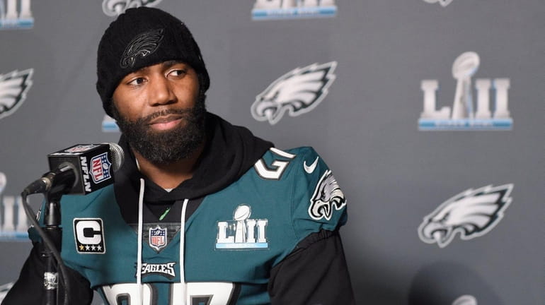 Malcolm Jenkins of the Eagles speaks to the media during...