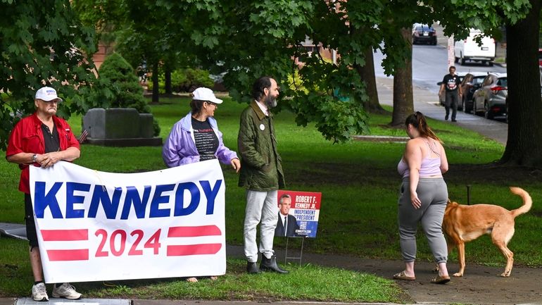 A small group of supporters wait for Independent presidential candidate...