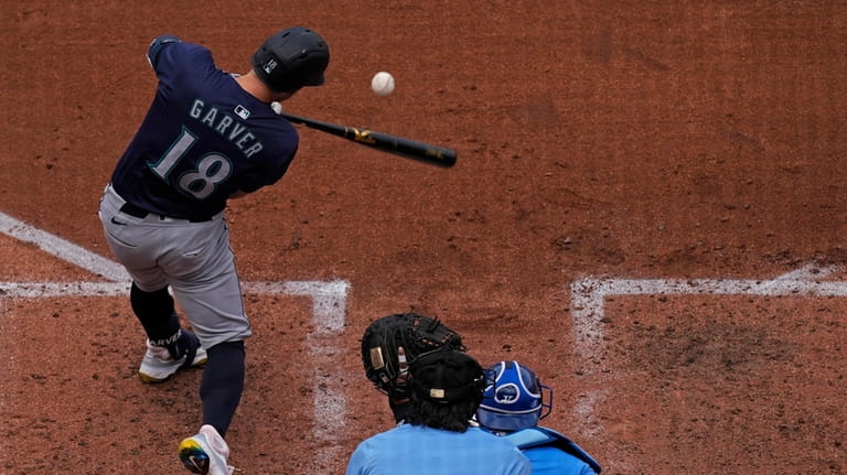 Seattle Mariners' Mitch Garver hits a solo home run during...
