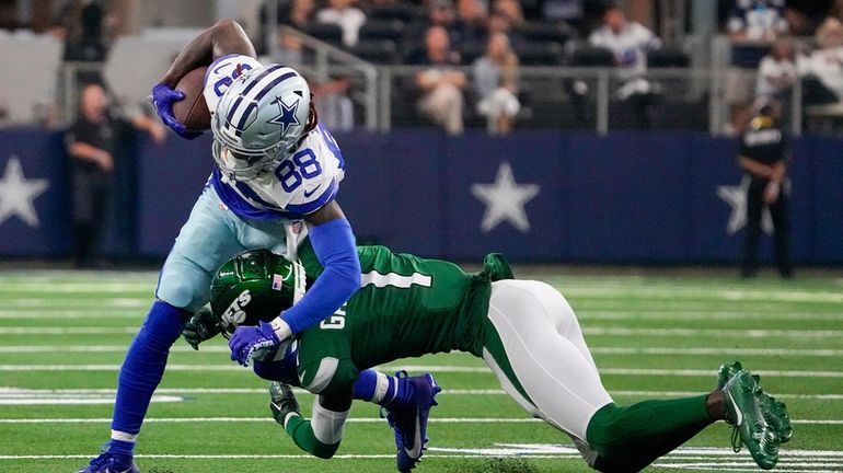 Dallas Cowboys wide receiver CeeDee Lamb is tackled by New...