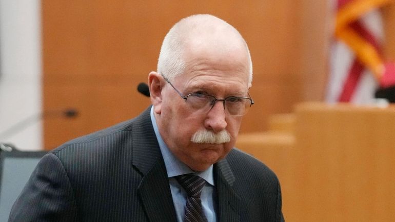 Retired Arizona Corrections Director Charles Ryan pauses in the courtroom...