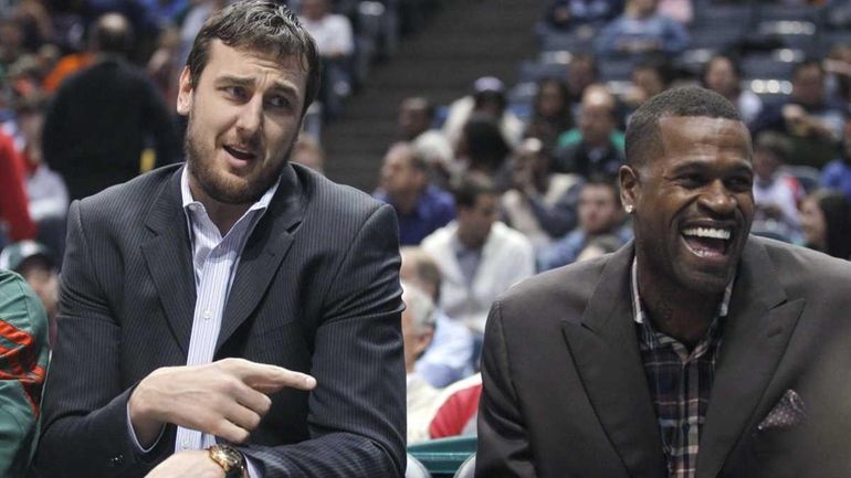 Milwaukee Bucks' Andrew Bogut, left, and Stephen Jackson sit on...