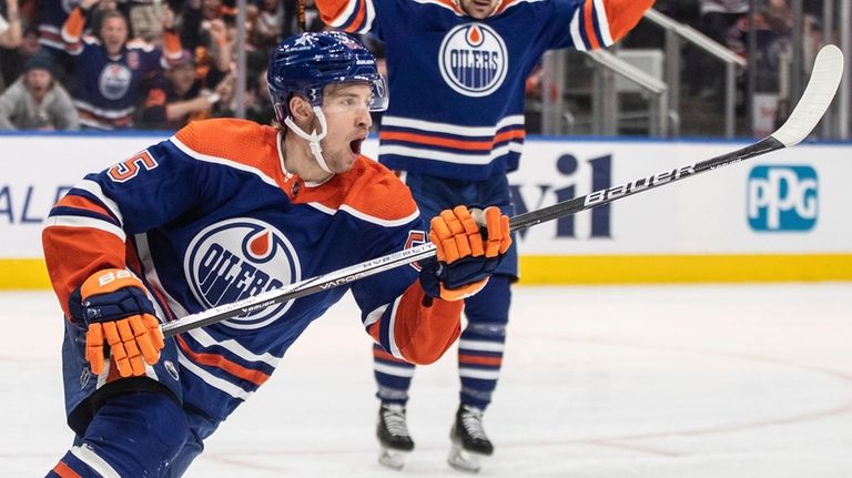 Edmonton Oilers' Dylan Holloway (55) celebrates a goal against the...