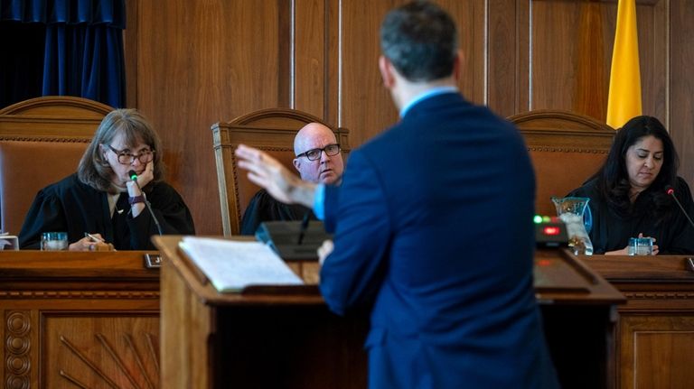 New Mexico Supreme Court Chief Justice Shannon Bacon, left, Justice...