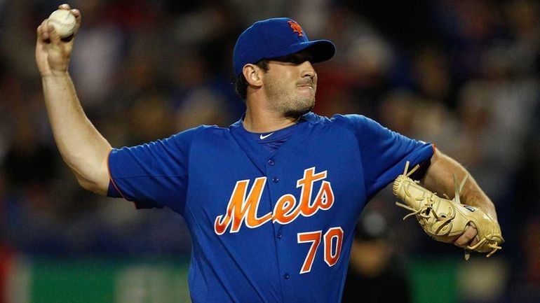 Matt Harvey #70 of the New York Mets pitches during...