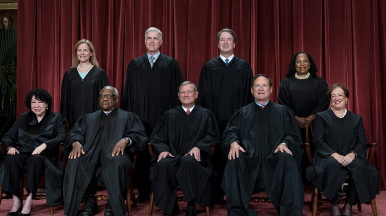 Members of the Supreme Court sit for a group portrait...