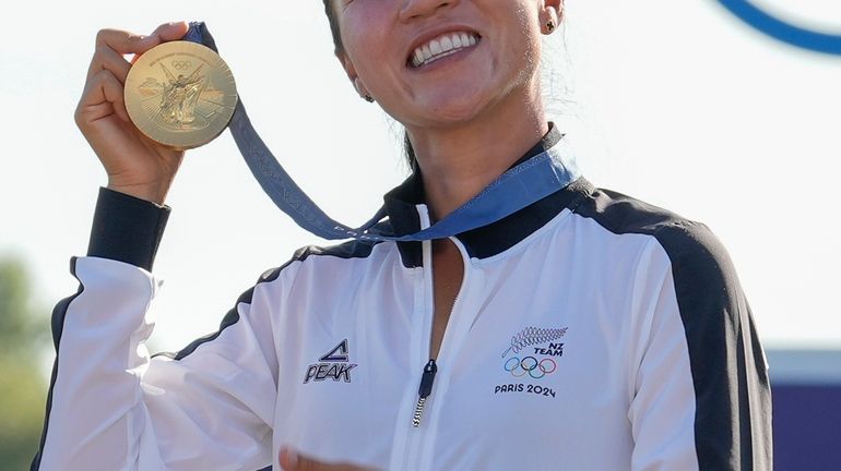 Lydia Ko, of New Zealand, poses for the cameras with...