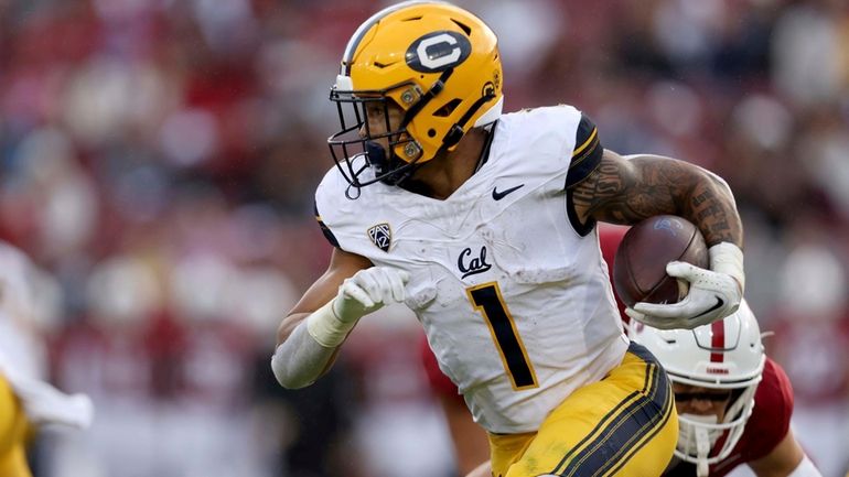 California running back Jaydn Ott runs against Stanford during the...