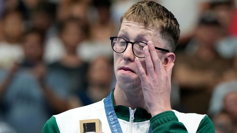 Gold medalist Daniel Wiffen of Ireland reacts after receiving his...