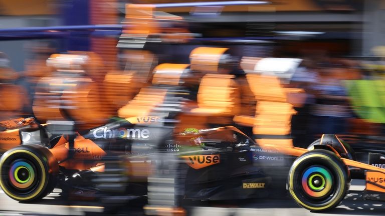 McLaren driver Lando Norris of Britain makes a pit stop...