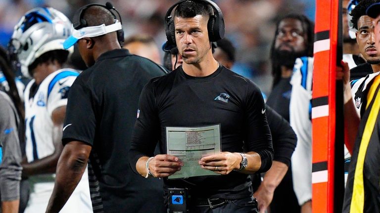 Carolina Panthers head coach Dave Canales watches from the sideline...