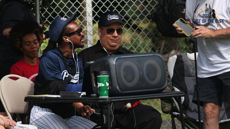 From left, Melchion Wee-Ellis and Derek Suarez play music during...