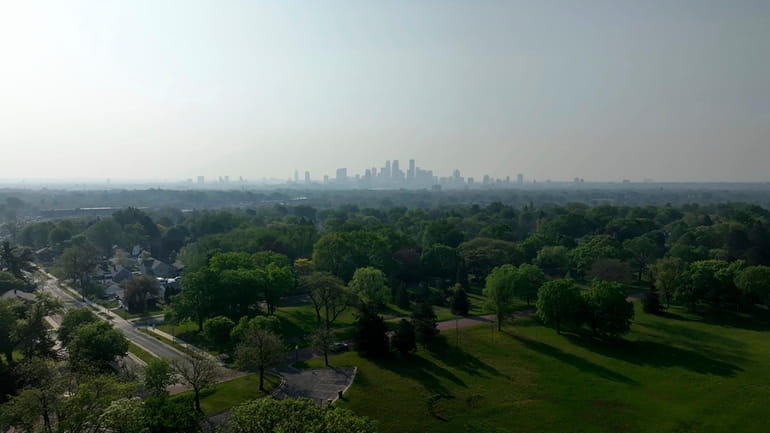 Wildfire smoke hangs over the Minneapolis on May 13, as...