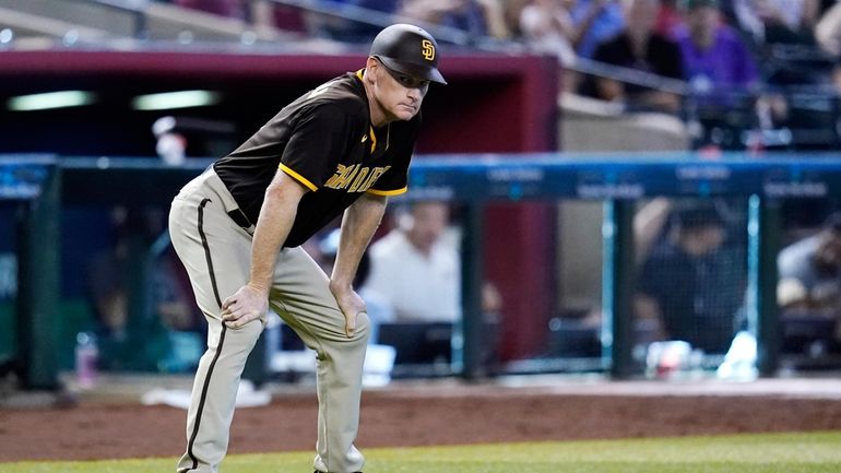 San Diego Padres third base coach Matt Williams pauses on...