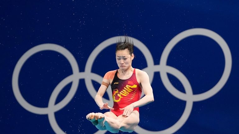 China's Chang Yani competes in the women's 3m springboard diving...