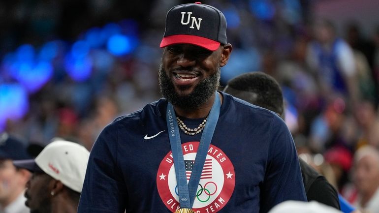 LeBron James wearing his gold medal is seen during a...