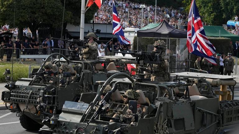 British troops from NATO member Poland and some of its...