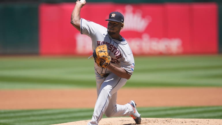 Houston Astros pitcher Ronel Blanco works against the Oakland Athletics...
