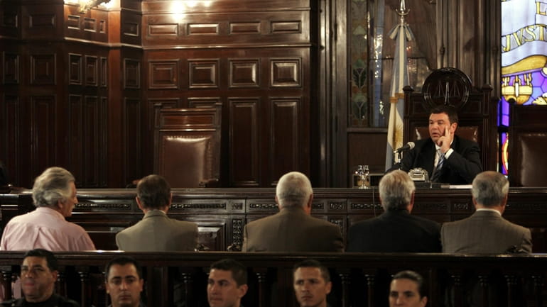 Judge Ariel Lijo presides over a trial of former military...