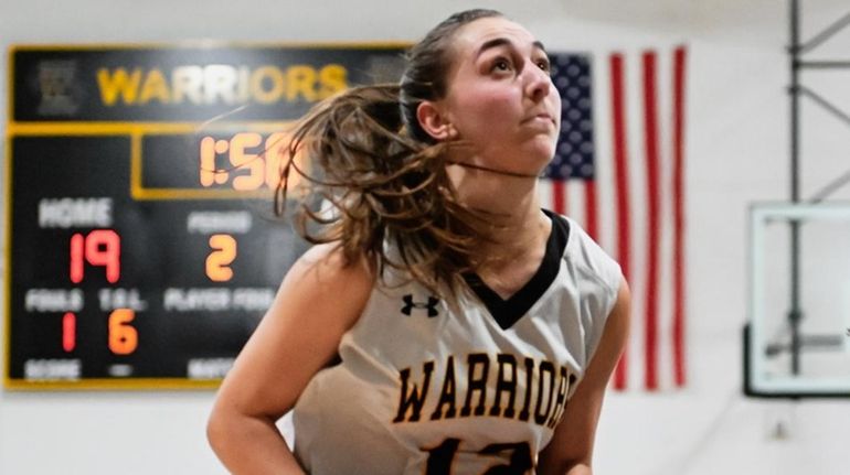 Casey Kissinger of Wantagh keeps her eyes on the net...