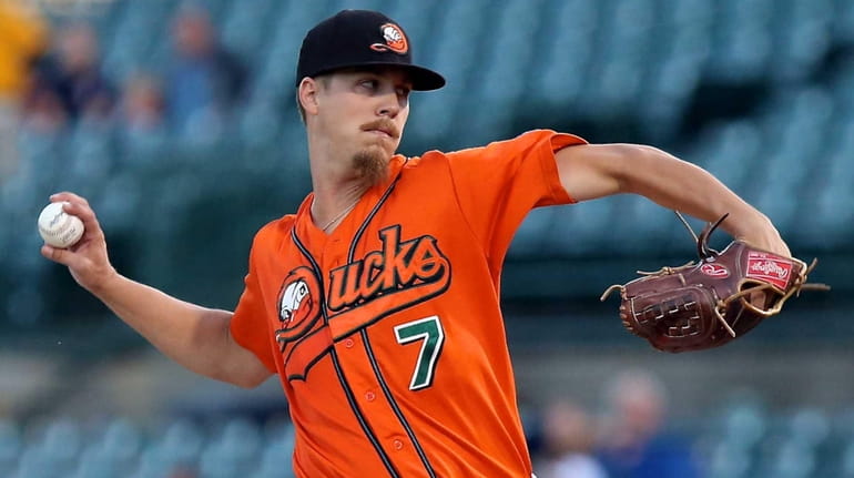 Long Island Ducks starting pitcher John Brownell delivers against the...