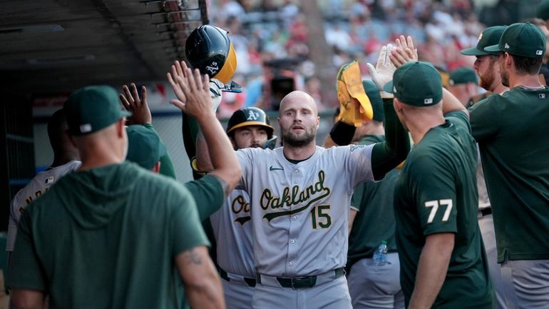 Oakland Athletics' Seth Brown (15) celebrates after hitting a home...