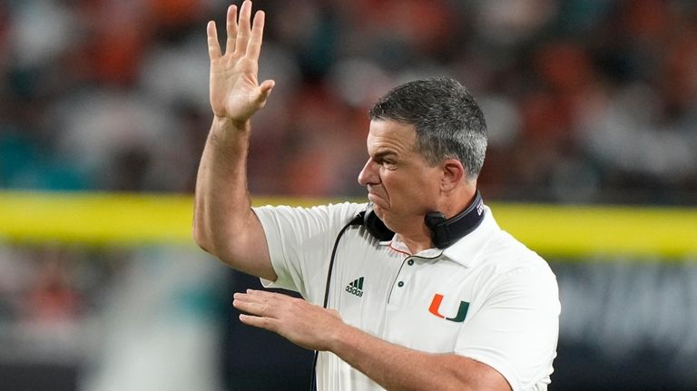 Miami head coach Mario Cristobal reacts to a call during...