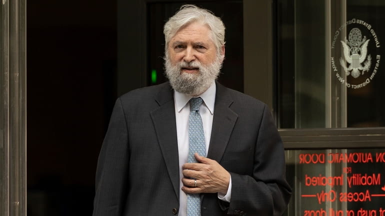 Michael Soshnick, attorney for Long Phi Pham, walks out of...
