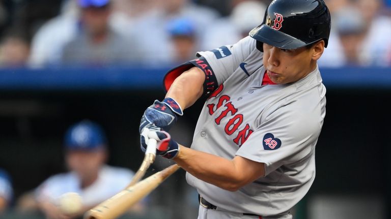 Boston Red Sox's Masataka Yoshida breaks his bat hitting a...