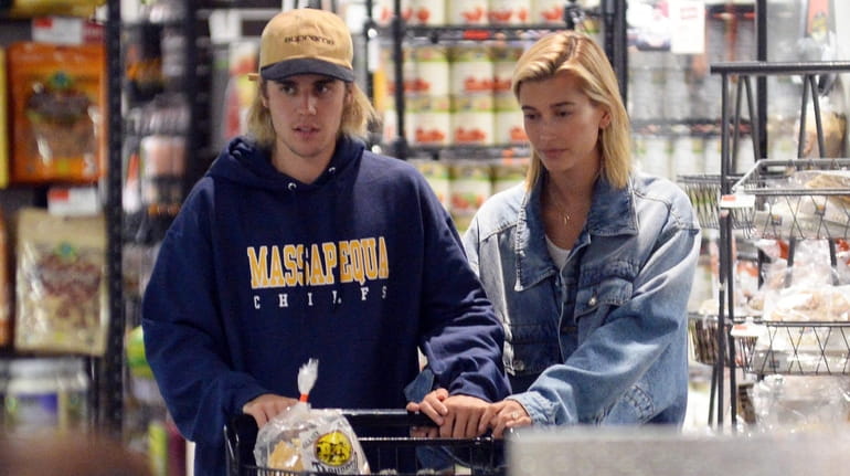 Justin Bieber and Hailey Baldwin do some grocery shopping at a...