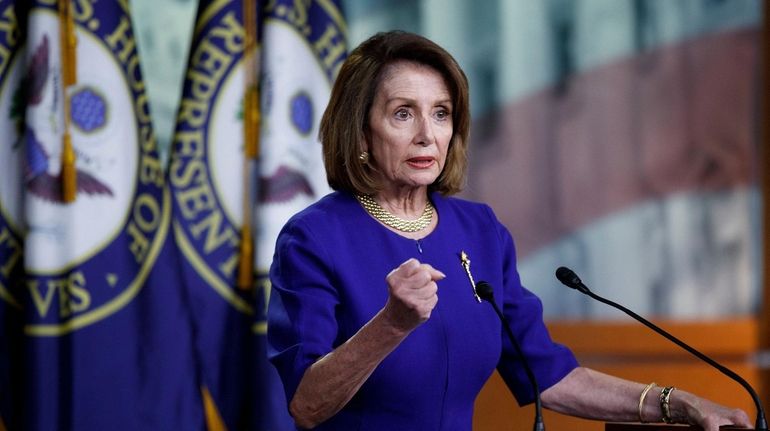 Speaker of the House Nancy Pelosi (R-Calif.) responds to a...